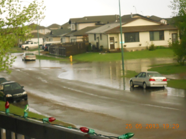 puddle of water after heavy rain in less than an hour Lloydminster, Saskatchewan Canada