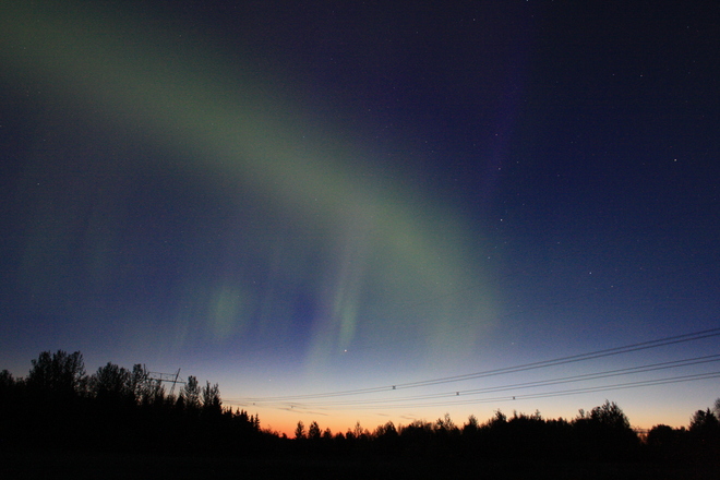 Aurora Borealis and first light of day Timmins, Ontario Canada