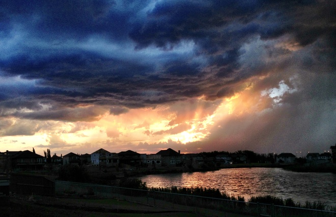 Sunset with storm clouds above Lakeland Village, Alberta Canada