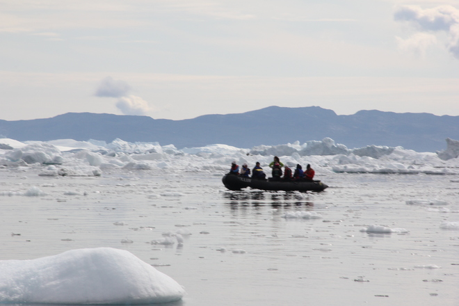 Zodiac cruising in icebergs Qikiqtarjuaq, Nunavut Canada