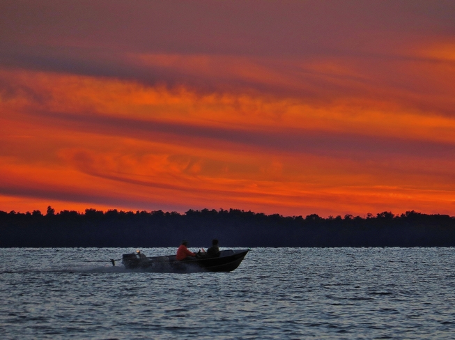 Heading out for an evening of fishing at sundown. North Bay, Ontario Canada