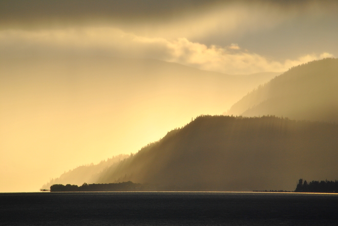 Rain shield across the lake South Kelowna, British Columbia Canada