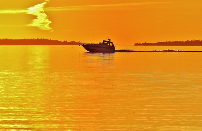Boating like it's summer on Lake Nipissing. North Bay, Ontario Canada