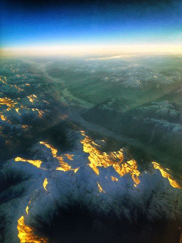 Gold Snow Mountains from the sky Calgary, Alberta Canada