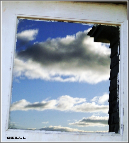 Cloud Reflections In A Window Canning, Nova Scotia Canada