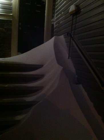 Blowing snow accumulation at my doorstep Calgary, Alberta Canada