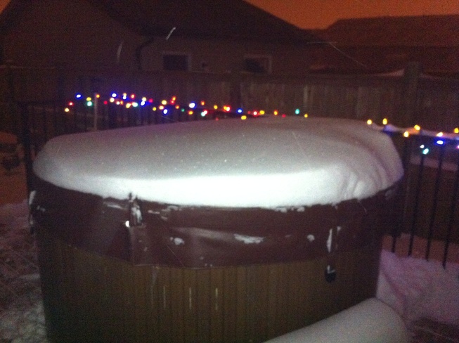 snow on our hottub Douglasdale, Alberta Canada