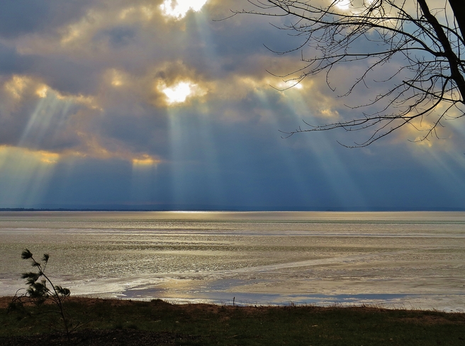 Rays breaking out all over the lake. North Bay, Ontario Canada
