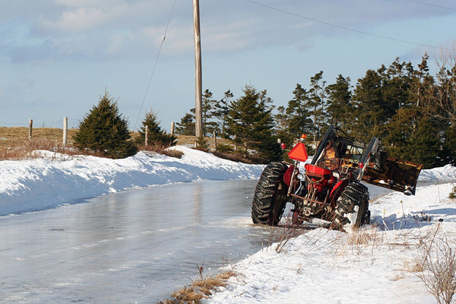 Tractor stuck on icy road L'Ardoise, Nova Scotia Canada