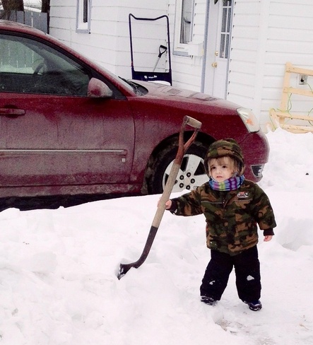 Learning to shovel already! Portage La Prairie, Manitoba Canada