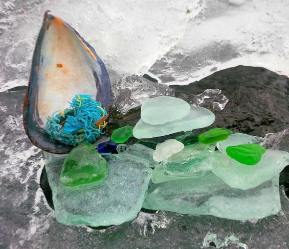 seaglass among the melting ice Canning, Nova Scotia Canada
