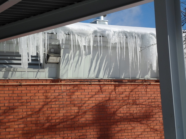 Ice hanging down from the building Elliot Lake, Ontario Canada