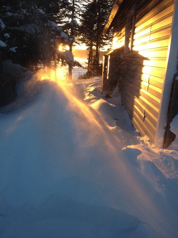 Sun reflecting off snow drift Hickman's Harbour, Newfoundland and Labrador Canada