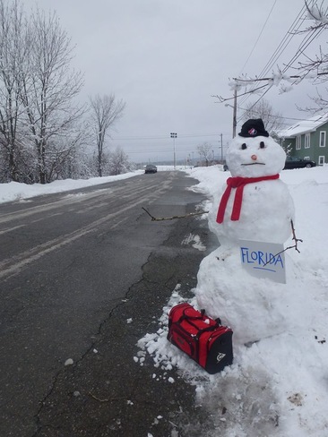 Snowman has enough! Antigonish, Nova Scotia Canada
