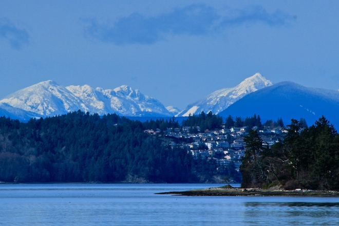 distant snow capped mountains Sidney, British Columbia Canada