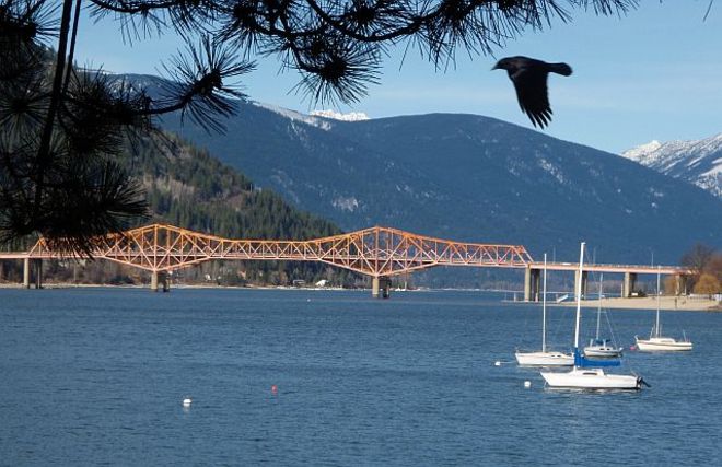 Bridge, boats and bird Slocan, British Columbia Canada
