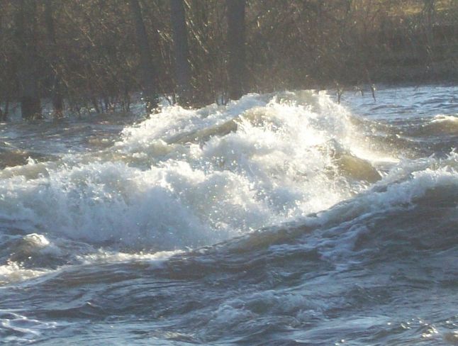 Large Waves and an Eddy signal the dangers occuring on the Moira River Belleville, Ontario Canada