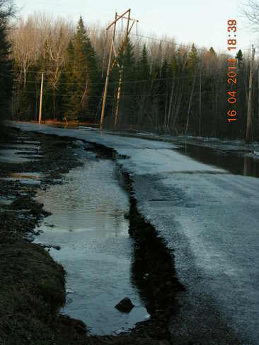 Flooded road and washed away half of it. Salisbury, New Brunswick Canada