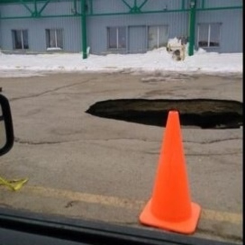 big hole by The Plaza Thompson, Manitoba Canada