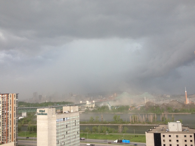 Sudden storm sweeps across the downtown of Montreal blowing winds create dust. 