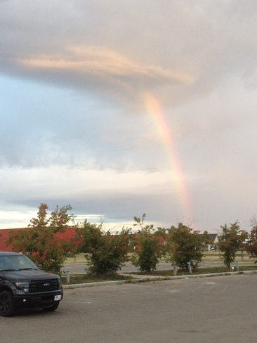 Rainbow pouring out of an unusual cloud Fort McMurray, AB