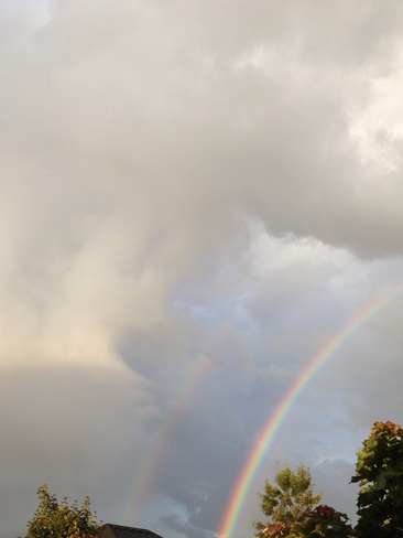 Double rainbow during sunshower Uxbridge, Ontario Canada