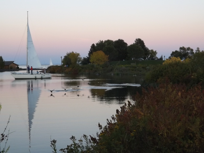 sailboat mirrors itself Thunder Bay, ON