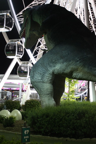 80 foot tall life size T-REX on the golf course Clifton Hill, Niagara Falls, ON