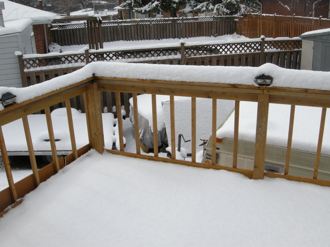 A portion of my back deck and yard. North Bay, ON