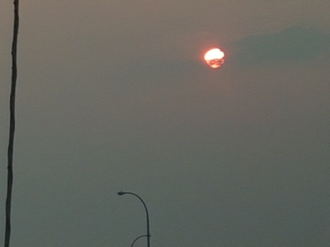 sun covered by smoke Clairmont, AB