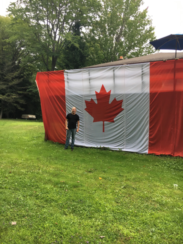 Biggest Canadian flag for Canada day 150 year celebration. Gift from peter Wahnekewaning Beach, Ontario, CA