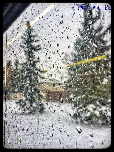 Through the LRT window: Rain ON the snow ! Edmonton, Alberta, CA
