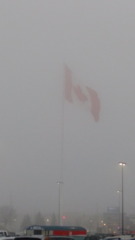 Huge flag in the fog Brockville, ON