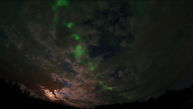 Clouds, moon , and northern lights Fort McMurray, Alberta, CA