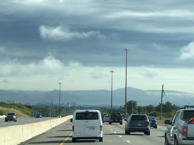 Driving to Toronto clouds look like mountains Mississauga, Ontario, CA