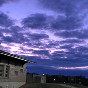Purple sky over football field