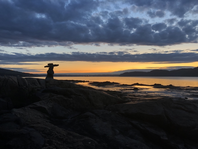 Lâ€™homme de pierre regarde au loin Saguenay, Québec | G7B 3P6