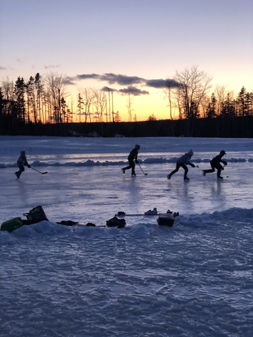 Pond hockey on a cool evening Timberlea, Nova Scotia, CA
