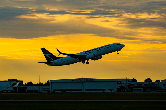 Westjet taking off into the sunset Ottawa