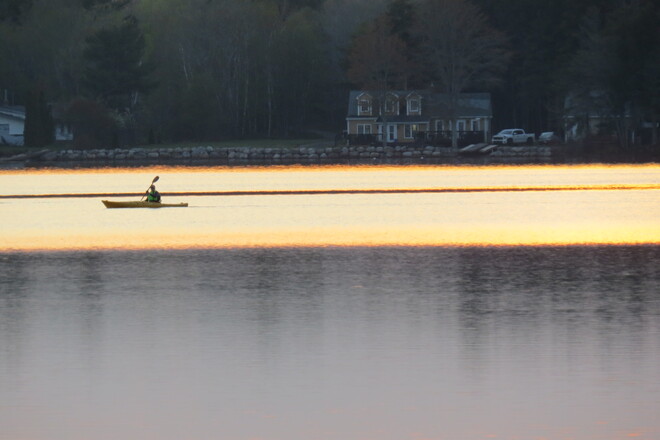 Sunset and boaters. Conquerall Mills, NS