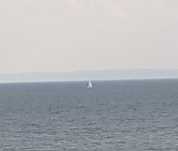 Sailboat in front of the Manitous North Bay, ON