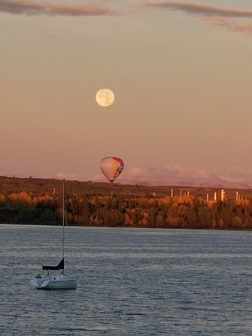 Fullmoon a hot air balloon over glemore resovoir Calgary, AB