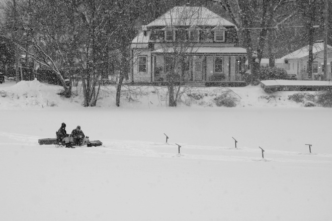 ice fishing in a snowstorm Châteauguay, QC