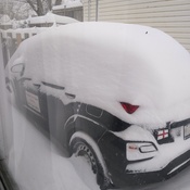 car almost buried from snowstorm. Loud bangs of lightning so loud in the night.