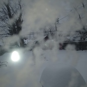 Look closely at how high that snow is on the table outside