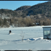 Winter ice fishing on a lake
