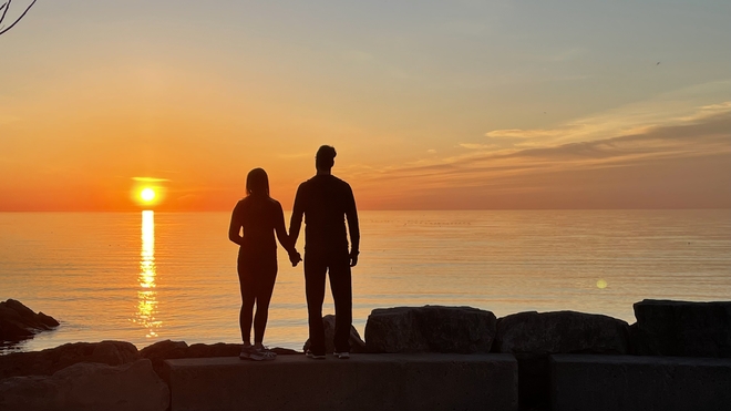 Lovers enjoying sunrise Burlington, Ontario, CA