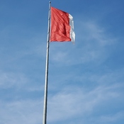 Canadian flag torn by winds