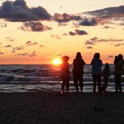 Family watching the Sunset at New Wasaga Beach