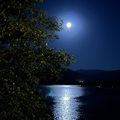 Full moon shining on Moyie Lake